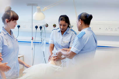 A student nurse undertaking a practical activity as part of their course.