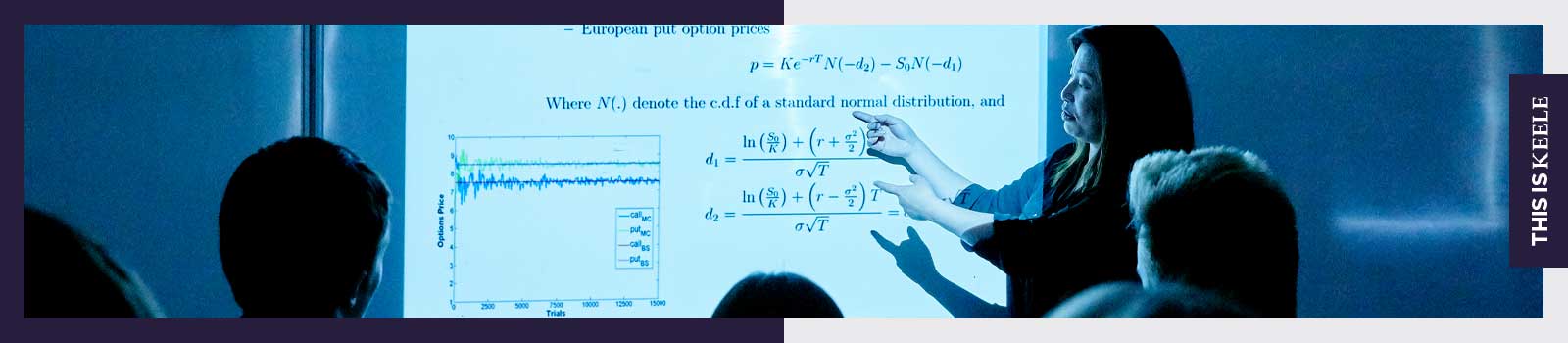 A female lecturer pointing at screen 