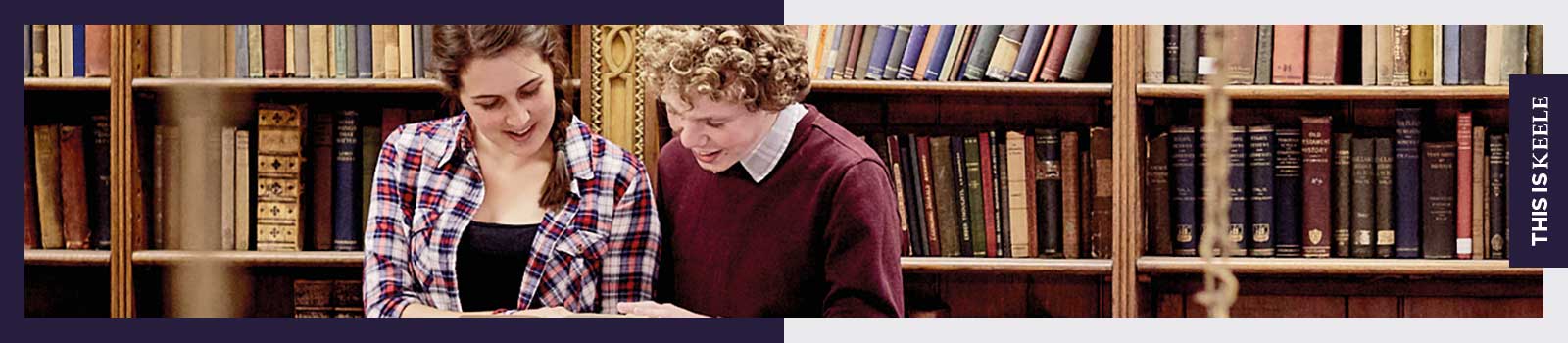 Students reading a book in Keele Hall's library